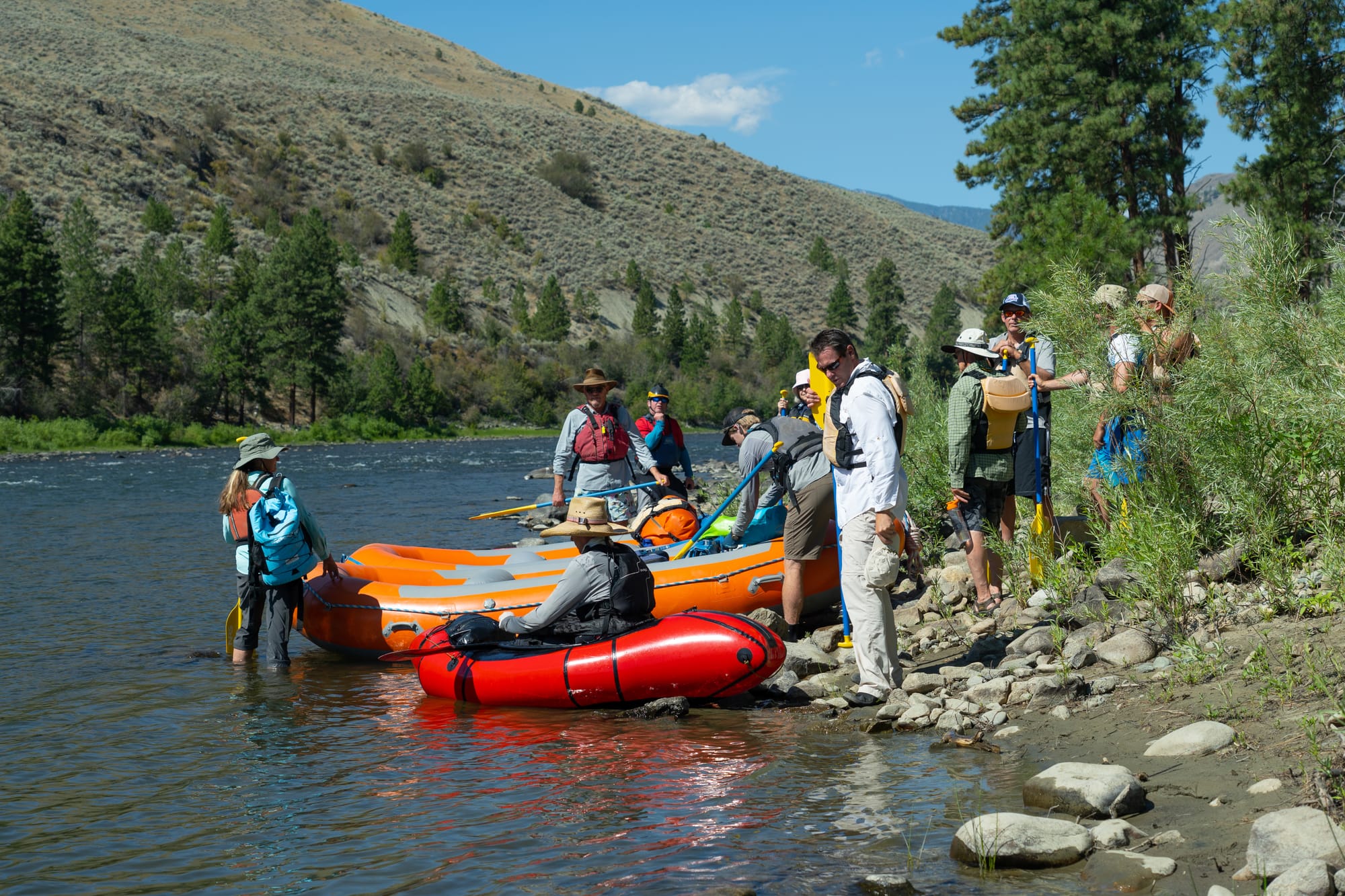 people gathering at rafts