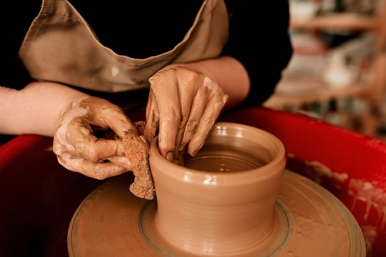 potter working on clay