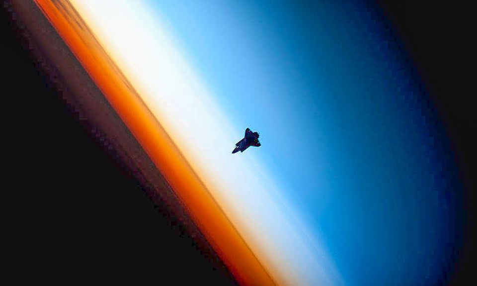 space shuttle above earth